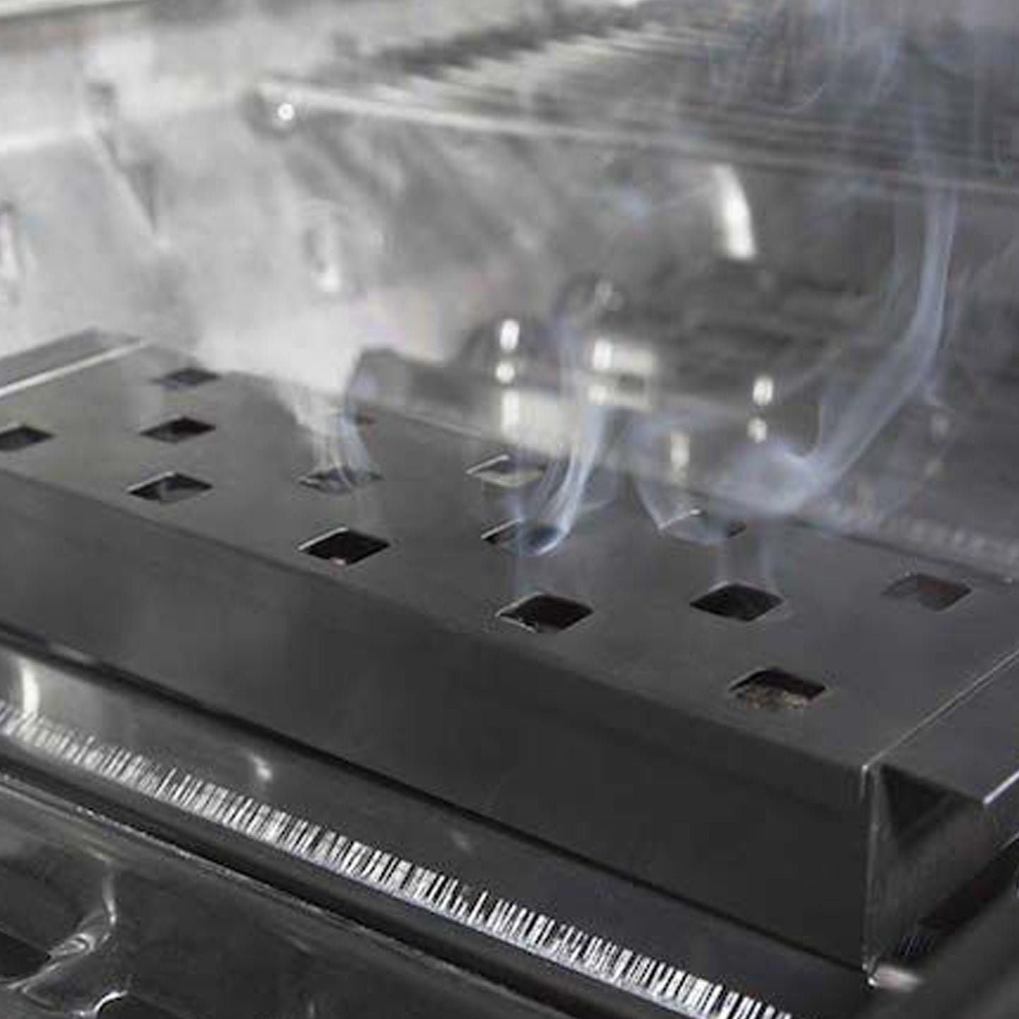 Broil King - Boîte en acier inoxydable pour le fumage à copeaux